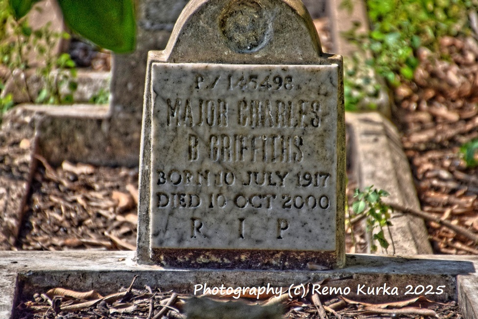Grave of Major Charles B Griffiths, died 2000, placed on an older soldier's headstone at Osu Military Cemetery